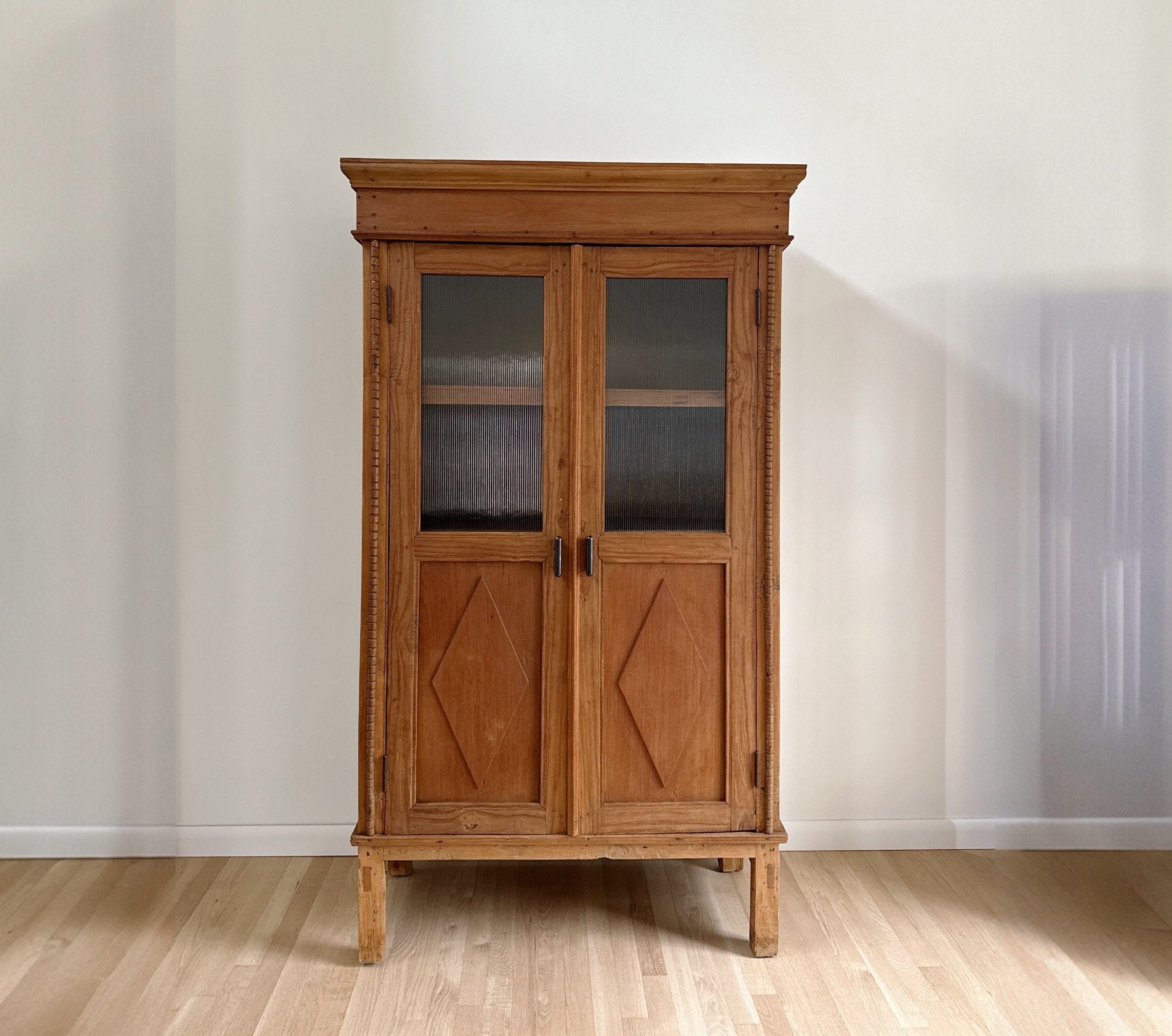 Antique primitive hutch cabinet with shelving, fluted glass and blackened bronze hardware 