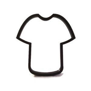 May include: A black, t-shirt shaped cookie cutter. The cutter is made of a dark material and has a simple outline of a t-shirt. The background is plain white.