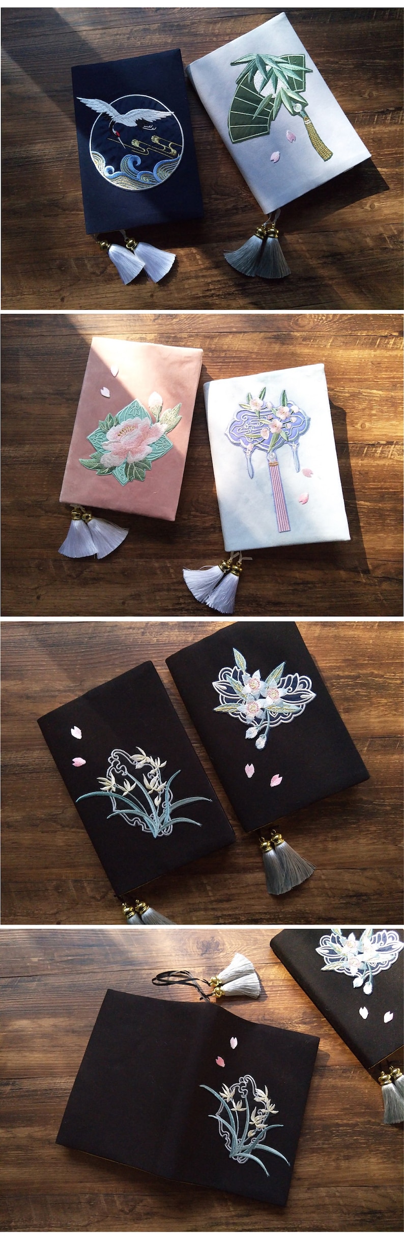 May include: Six different book covers with embroidered designs. The covers are in various colors, including black, white, blue, pink, and green. Each cover features a different floral or nature-inspired design, such as a crane, bamboo, a flower, and a fan. The covers have tassels attached to them.
