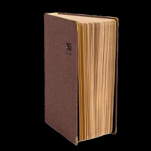 May include: A brown hardcover journal with gold accents and the text "365 Days" on the front cover.