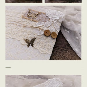 May include: A white journal with a lace and burlap cover. The cover is decorated with butterflies, buttons, and flowers. The journal is perfect for writing down your thoughts and dreams.