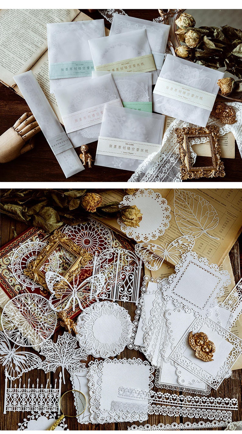 May include: A set of white lace paper die cuts featuring various designs, including butterflies, leaves, and geometric patterns. The die cuts are arranged on a wooden surface.