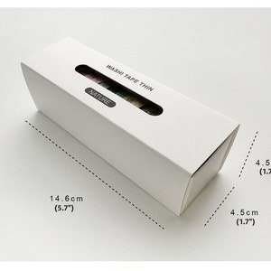 May include: A white box containing a set of washi tape rolls. The box is labeled "Washi Tape Thin" and "Nature". The box measures 5.7 inches long and 1.7 inches wide.