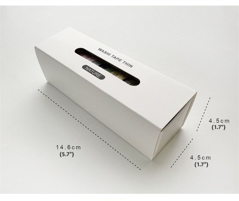May include: A white box containing a set of washi tape rolls. The box is labeled "Washi Tape Thin" and "Nature". The box measures 5.7 inches long and 1.7 inches wide.