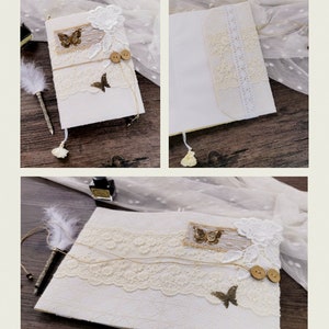 May include: A white A5 notebook cover with lace trim, brown buttons, and gold butterfly accents. The cover is decorated with a burlap and lace overlay.