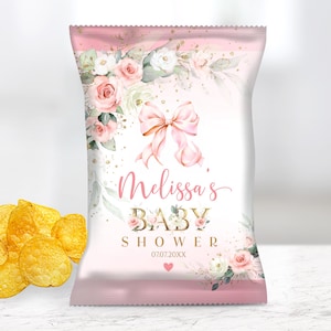 May include: A pink and white baby shower chip bag design with floral accents, a bow, and the text "Melissa's Baby Shower". The bag is next to a pile of golden potato chips. The text "YOU WILL RECEIVE AN EDITABLE FILE 8,5X11 INCHES" is at the top.