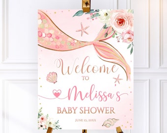 May include: Pink and gold mermaid tail baby shower welcome sign with floral accents and the text "Welcome to Melissa's Baby Shower June 15, 20XX".