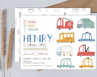May include: A colorful invitation for a birthday party with a transportation theme. The invitation features a variety of vehicles, including a school bus, a fire truck, a police car, and an ice cream truck. The text on the invitation reads "Honk, Beep, Vroom. Henry is turning three!" and includes details about the party, such as the date, time, and location.