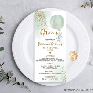 May include: A light blue and green baby shower menu card with gold glitter. The menu card features a watercolour balloon with eucalyptus leaves and the text "Menu", "Welcome to Robert and Melissa's Baby Shower 08.08.20XX". The menu lists appetizers, entrees, a mimosa bar, and a dessert bar.