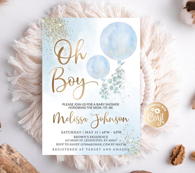 Flat lay of the Oh Boy watercolor invitation surrounded by bohemian decor details.