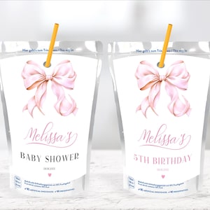 May include: Two clear plastic pouches with pink ribbon designs and text that reads "Melissa's Baby Shower" and "Melissa's 5th Birthday".