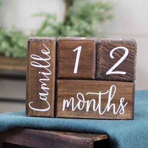 Baby milestone blocks in walnut by Birchmark Designs