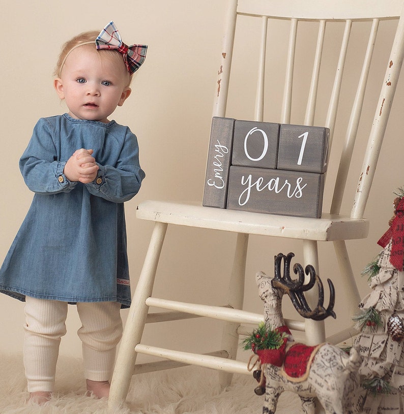 Milestone blocks by Birchmark Designs in Willow script font with a one year old baby