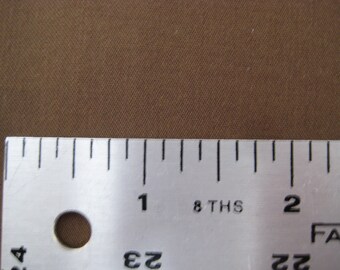 May include: Close-up of a ruler with markings in inches and eighths of an inch. The ruler is made of metal and has a silver finish. The numbers 1 and 2 are visible on the ruler.