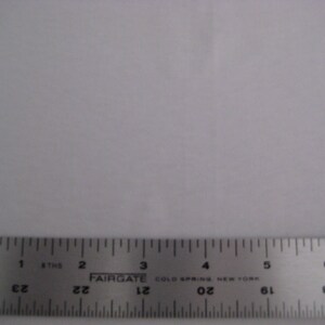 May include: A silver metal ruler with black markings. The ruler is 6 inches long and has markings for every 1/16th of an inch. The ruler is labeled "FAIRGATE COLD SPRING NEW YORK".