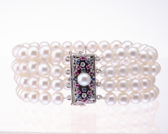 Vintage Cultured Pearl 4 Row Bracelet with Ruby,Sapphire and Diamond Clasp.Four row Pearl bracelet, 18ct Ruby,Sapphire and Diamond clasp.