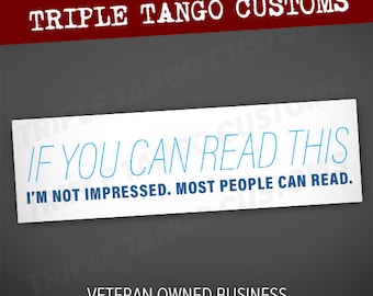 May include: White sticker with blue text that reads "IF YOU CAN READ THIS I'M NOT IMPRESSED. MOST PEOPLE CAN READ."  The sticker has a red banner at the top that reads "TRIPLE TANGO CUSTOMS". Below the sticker is a black and white American flag and the text "VETERAN OWNED BUSINESS MADE IN THE USA".