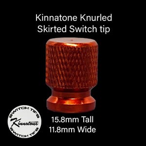 May include: A set of three ceramic mugs with a speckled, matte finish. The mugs are in shades of cream, light gray, and dark gray. Each mug has a simple, modern design and a rounded handle.