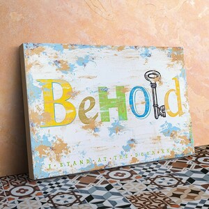 May include: A distressed wooden sign with the word "Behold" in colorful letters. The letters are painted in yellow, green, blue, and yellow. A keyhole is painted in the center of the sign with a key inside.