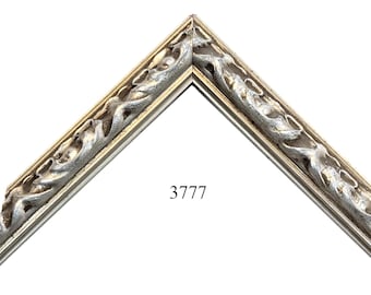 May include: A silver and white ornate picture frame with a decorative, swirling design. The frame is labeled with the number 3777.