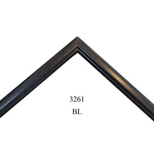 May include: Black picture frame with a beveled edge and a rounded corner. The frame is labeled "3261 BL".