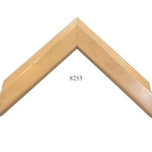 May include: A light wood picture frame with a beveled edge and a simple design. The frame is labeled with the number 8253.