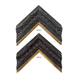 May include: Two ornate picture frames with a black and gold finish. The top frame is labeled "4662" and the bottom frame is labeled "4664".