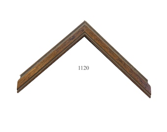 May include: An L-shaped corner section of a picture frame featuring a medium brown wood grain finish with dark brown streaks and a stepped profile. The number 1120 is printed in black text in the center of the open space within the frame corner.