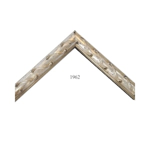 May include: A silver-toned picture frame corner section featuring a repeating embossed leaf pattern along the length of the molding. The frame has a weathered finish and the number 1962 is printed in black text in the center of the open space.
