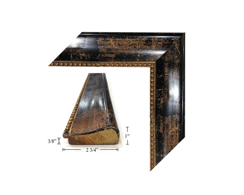 May include: A black picture frame with gold accents and a beaded edge. The frame is 3/8 inches thick and 2 3/4 inches wide. The frame is shown in two views, one showing the side profile and the other showing the corner.