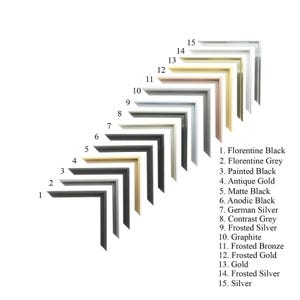 May include: A collection of fifteen L-shaped picture frame corner samples arranged diagonally. Each sample is numbered and labeled with finishes including Florentine Black, Antique Gold, German Silver, Graphite, Frosted Bronze, and Silver.