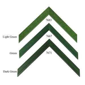 May include: Three wooden picture frames in different shades of green: light green, green, and dark green. The frames are all the same size and shape, with a beveled edge. The frames are labeled with their corresponding colors and product numbers: 7683, 7667, and 7671.