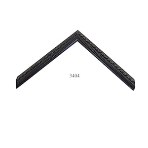 May include: A black picture frame corner sample featuring an ornate, raised leaf-like pattern along the inner edge and a smooth outer border. The number 3404 is printed in black text near the center of the V-shaped frame section.