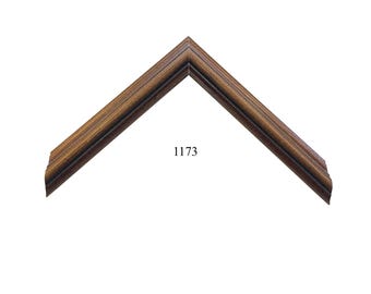 May include: An L-shaped corner section of a picture frame featuring a dark brown wood grain finish with subtle black highlights and a stepped profile. The number 1173 is printed in black text in the center of the frame corner section.
