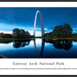 May include: A panoramic view of the Gateway Arch National Park in St. Louis, Missouri. The iconic stainless steel arch is reflected in a still pond in the foreground. The city skyline is visible in the background.