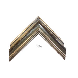 May include: A silver and black picture frame with a beveled edge and a simple design. The frame is labeled with the number 5114.