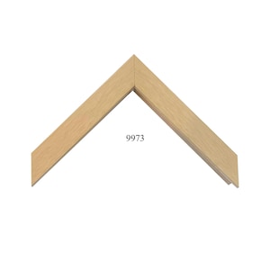 May include: A light brown wooden picture frame corner sample with a smooth, flat surface and a clean mitered joint. The wood features a natural grain pattern and a light tan finish. The number 9973 is printed in black text in the center area.