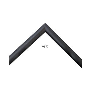 May include: A matte black picture frame corner sample featuring a clean, angled miter joint. The frame profile has a smooth, solid black finish. The number 9577 is printed in black text in the center of the open space between the two frame sides.