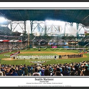 May include: Panoramic framed photograph of a Seattle Mariners baseball game at T-Mobile Park. The image shows a packed stadium with fans, the baseball field, and the American flag. The text "Seattle Mariners" is visible.
