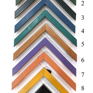 May include: Eleven different picture frames in various colors, including dark blue, green, teal, brown, purple, orange, yellow, white, black, and peach. The frames are arranged in a pyramid shape, with the largest frame at the top and the smallest frame at the bottom.