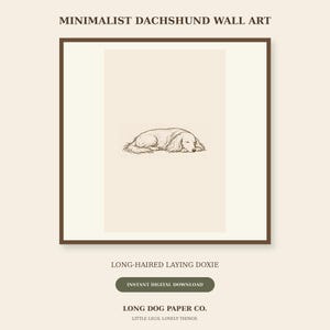 May include: A framed wall art print featuring a brown line drawing of a long-haired dachshund lying down. The text reads MINIMALIST DACHSHUND WALL ART, LONG-HAIRED LAYING DOXIE, INSTANT DIGITAL DOWNLOAD, LONG DOG PAPER CO. LITTLE LEGS. LOVELY THINGS.