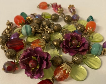 Charm necklace with vintage bead assortment, enameled flowers, cranberry glass, sugar beads, glass leaves, textured metal beads, 17" long