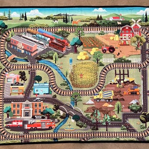 Quilted playmat with roads and railroad tracks