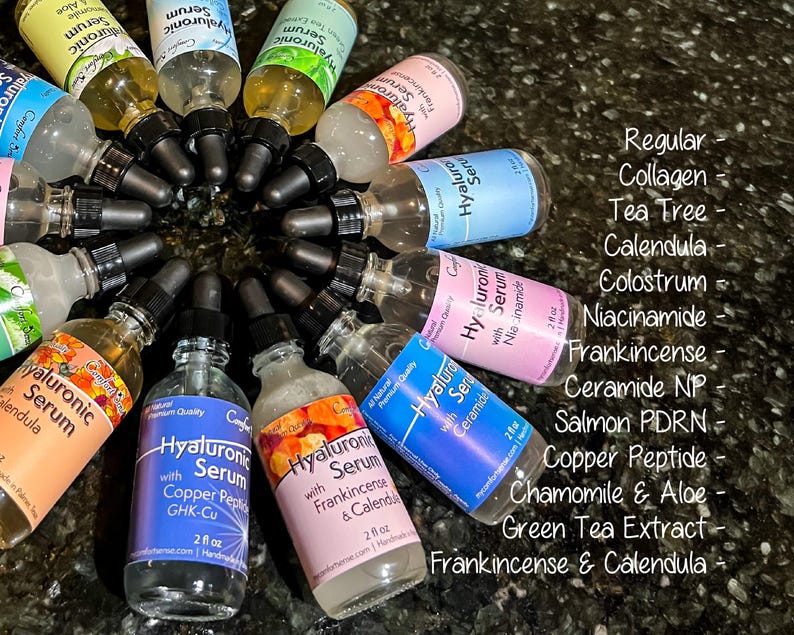 May include: A collection of glass dropper bottles containing Hyaluronic Serum in various formulations, including Collagen, Tea Tree, Calendula, Colostrum, Niacinamide, Frankincense, Ceramide NP, Salmon PDRN, Copper Peptide, Chamomile & Aloe, and Green Tea.