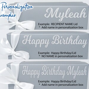 May include: Three examples of personalized gift boxes with white ribbon bows. The top box has the name "Myleah" in white glitter lettering. The middle box has the text "Happy Birthday" in white glitter lettering. The bottom box has the text "Happy Birthday Myleah" in white glitter lettering.