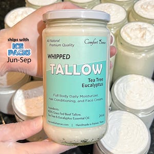 May include: A clear glass jar with a white lid and a label that reads "Whipped Tallow Tea Tree Eucalyptus." The jar contains a white, creamy substance. The label also states the product is a full body daily moisturizer and contains 24 oz.
