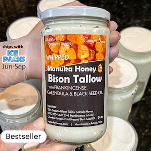 May include: A jar of whipped Manuka Honey Bison Tallow with Frankincense, Calendula, and Black Seed Oil. The label reads "All Natural Premium Quality" and lists ingredients. The jar is held by a gloved hand. The text "Bestseller" is also visible.