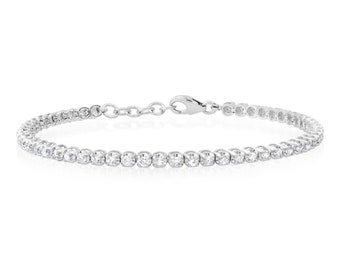 Mini tennis bracelet with read diamonds and 14k gold.