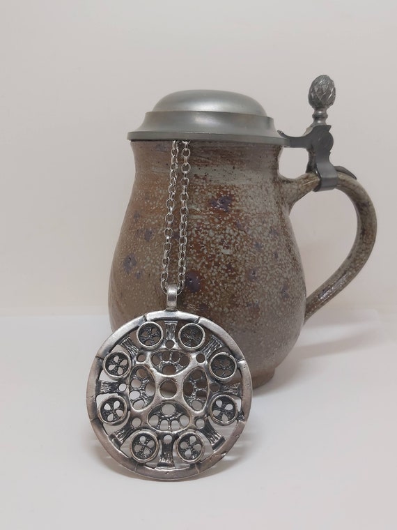 Helge Rasmussen's machine-inspired pewter pendant, Norway, Norwegian, steampunk, retrofuturistic technology, industrialism