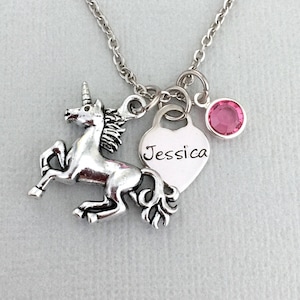 May include: Silver necklace with a unicorn charm, a heart charm with the name "Jessica" engraved on it, and a pink crystal charm.